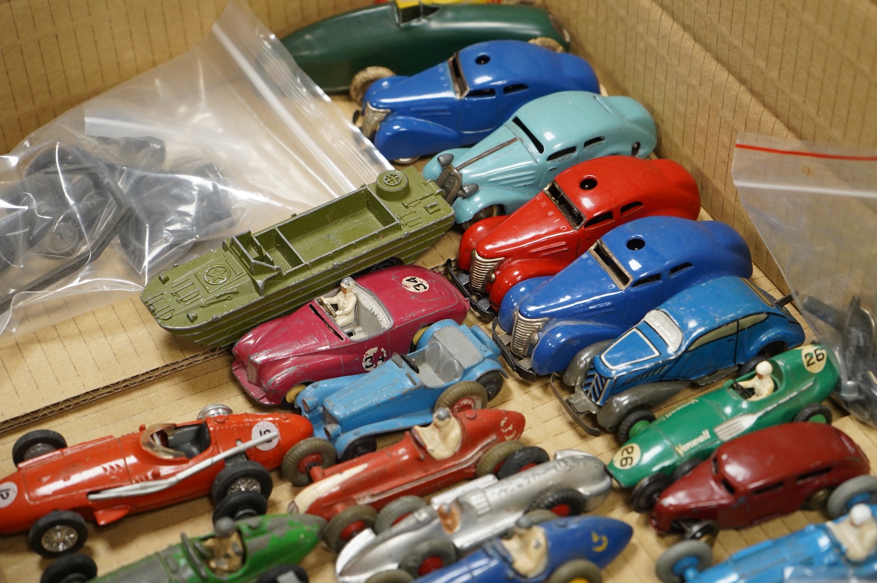 Twenty-eight diecast and tinplate vehicles by Dinky Toys, Schuco, Crescent, Corgi Toys, etc., including a good selection of single seat racing cars, three Schuco telesteering cars, etc.